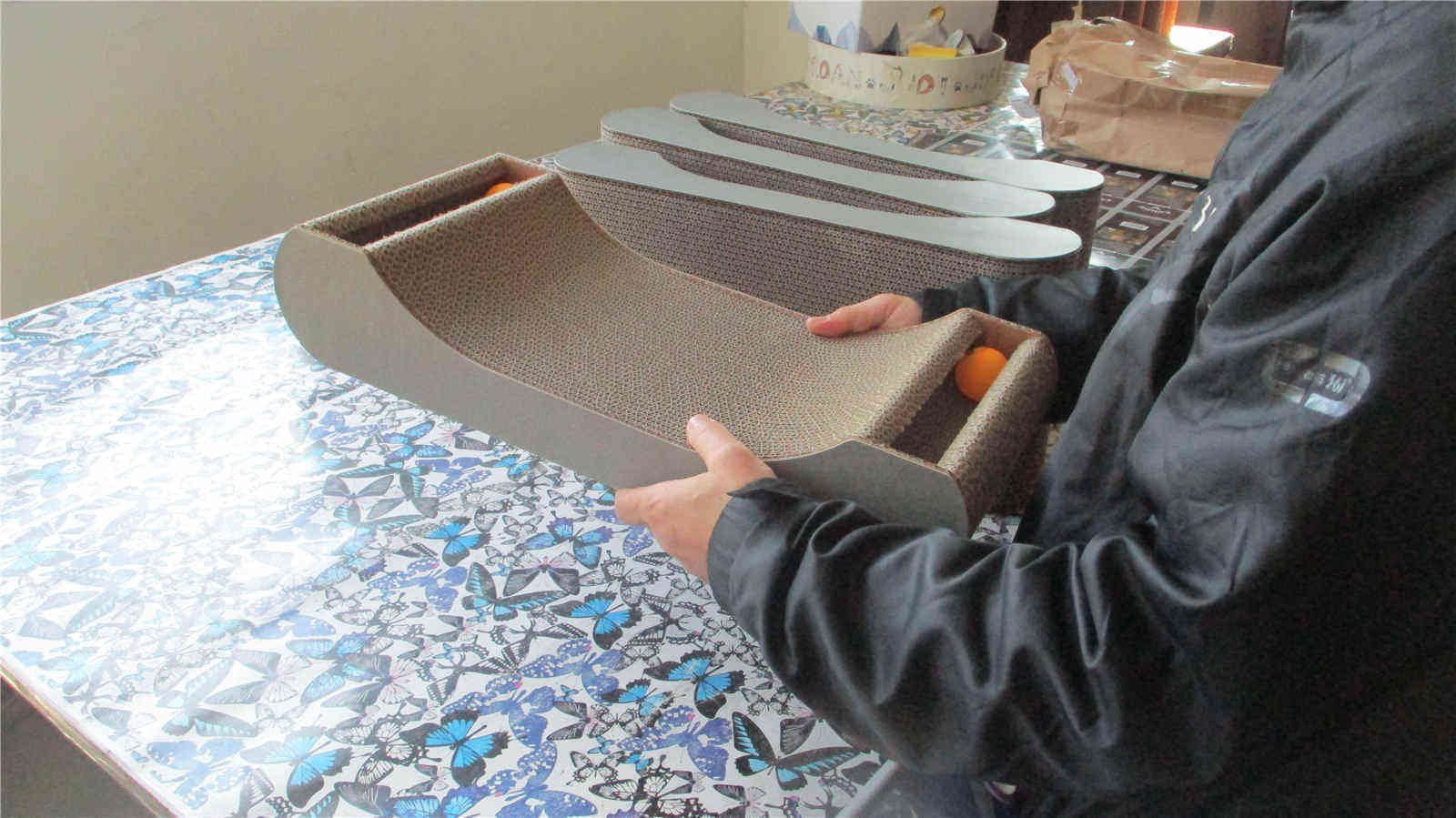 Cat scratcher being checked during production