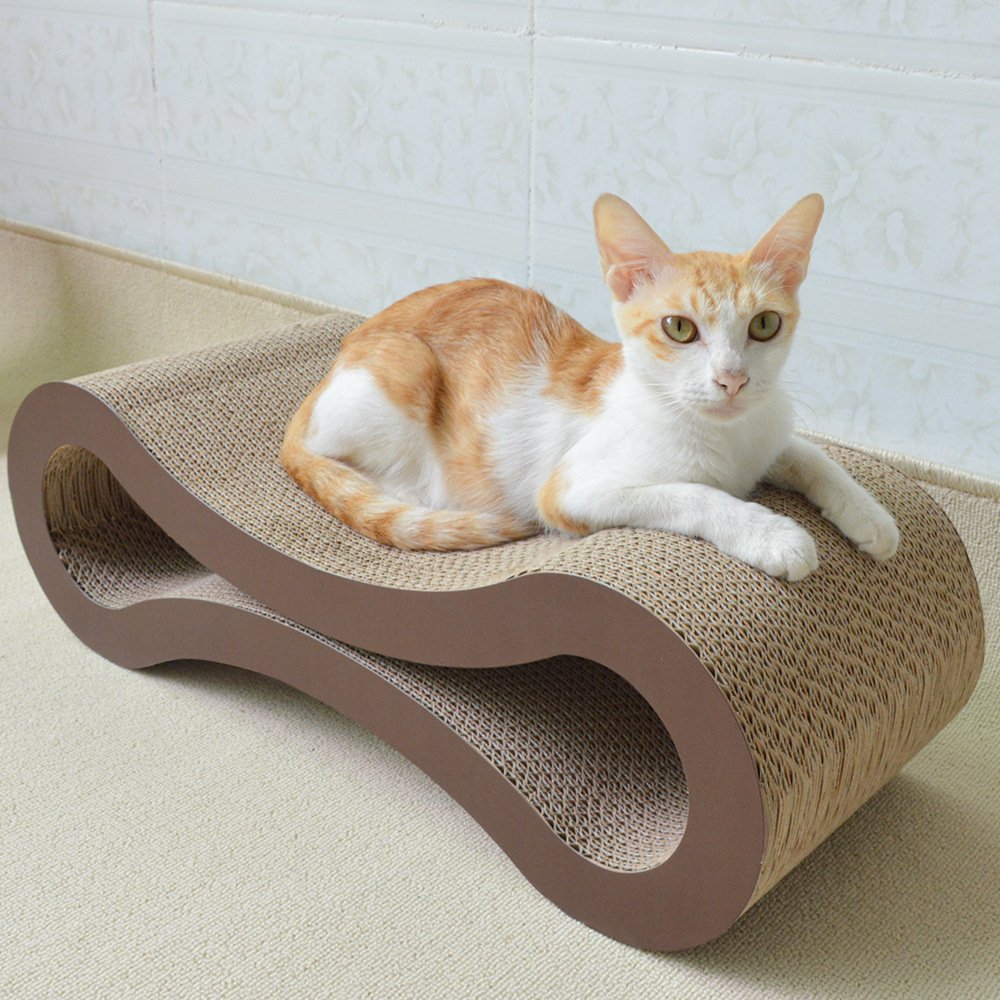 Orange and white cat on a sturdy curved corrugated cardboard scratching board